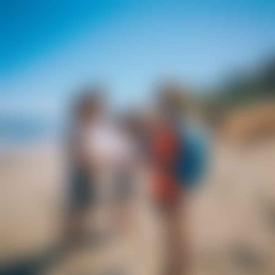 Children participating in a beach scavenger hunt during a family beach drive